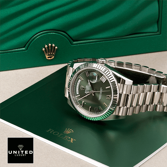 Rolex Day-Date 228239-0033 "Green Dial" Ultra Fine Replica rolex day date 228239 stainless steel green dial Rolex Day-Date 228239-0033 Romen Numerial Olive Green Dial Replica in front of Rolex Box