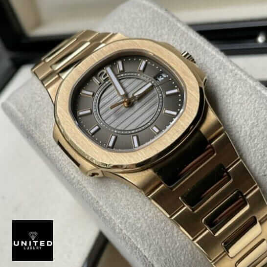 Patek Philippe Nautilus 7011/1R "Rose Gold" Exact Duplicate Quality patek 7011 1r 010 replica 5 Patek Philippe 7011-1r-010 Black Dial Gold Bracelet Replica on the stand